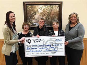 Forward employees present members of the Clark County United Way with $2,300 donation.