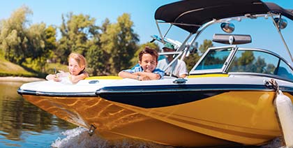 cheerful siblings enjoy view from boat bow on sunny day