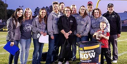 Forward employees pose for photo at $5,000 Touchdown Throw in Park Falls