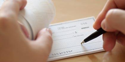 close up of writing a check