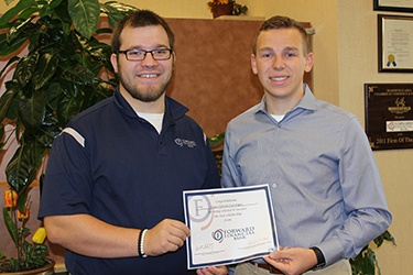 Chris Damerell from Forward Bank presents Ryan Dieringer from Columbus High School with $500 scholarship.