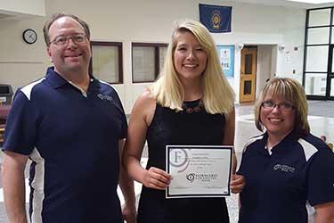 Mike Henke and Andrea Hazard from Forward Bank present Heather Milas from Stanley-Boyd High School with $500 scholarship.