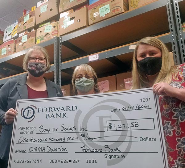 Forward Bank presents Soup or Socks in Marshfield with donation on behalf of customers participating in the Charitable Money Market Account program.