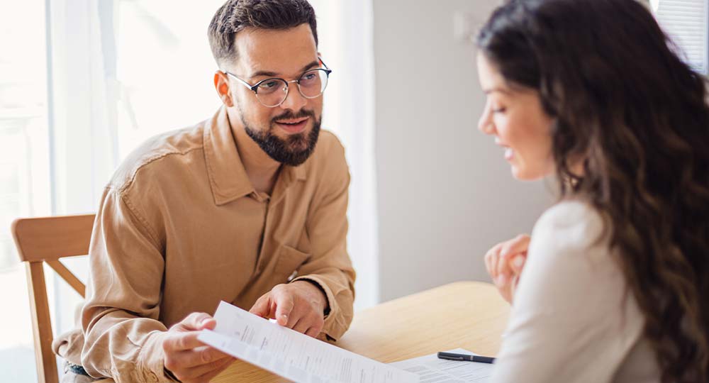 A mortgage lender discussing pre-approval and pre-qualification options with a first-time homebuyer.