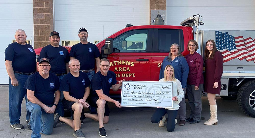 Forward presents check to Athens Fire Department for 2026 Band sponsorship