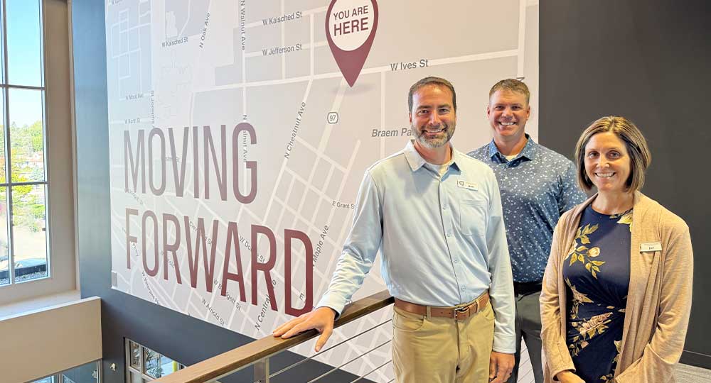 Three Forward Bank leaders—Brent Arndt, Butch Wiegel, and Jeri Koester—stand together ready to build what's next.