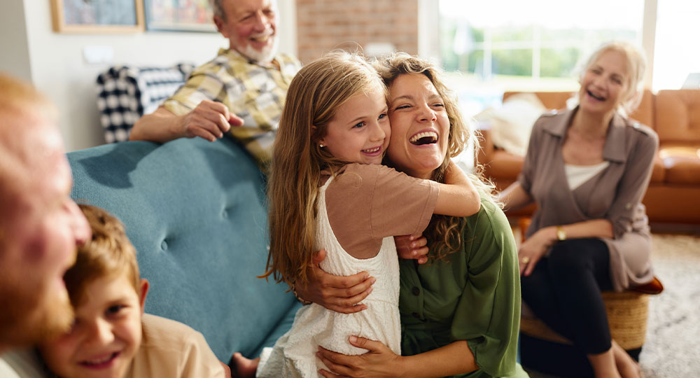 A multigenerational family enjoying time together at home, representing how estate planning can help protect your family.